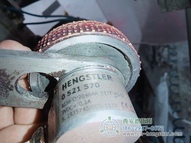 图为配测量轮使用的亨士乐RI36系列编码器照片