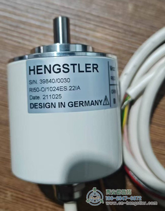 图为皮带输送机上常用的一款用于测速的亨士乐增量编码器照片